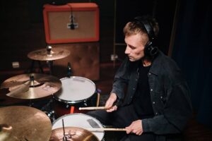 why do drummers wear headphones